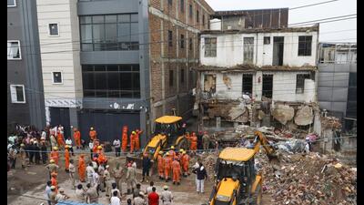 Rescue operations underway at the site on Friday. (PTI) Rescue operations underway at the site on Friday. (PTI)