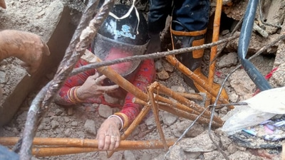 Woman being rescued from the rubble after a building collapsed in Delhi's Jahangirpuri area on Friday afternoon. (via HT )