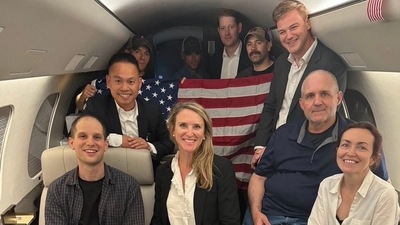 TOPSHOT - In this image released by the US Government, US journalist Evan Gershkovich (L), former US Marine Paul Whelan (2R) and US-Russian journalist Alsu Kurmasheva (R) are seen on a plane after their release from Russia on August 1, 2024. Gershkovich, Whelan, Kurmasheva and Russian opposition activist Vladimir Kara-Murza were part of a 24-prisoner swap with Russia. (AFP) TOPSHOT - In this image released by the US Government, US journalist Evan Gershkovich (L), former US Marine Paul Whelan (2R) and US-Russian journalist Alsu Kurmasheva (R) are seen on a plane after their release from Russia on August 1, 2024. Gershkovich, Whelan, Kurmasheva and Russian opposition activist Vladimir Kara-Murza were part of a 24-prisoner swap with Russia. (AFP)