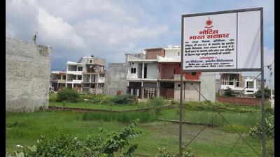 The agency put up new boards to reclaim the property, said officials. (HT Photo) The agency put up new boards to reclaim the property, said officials. (HT Photo)
