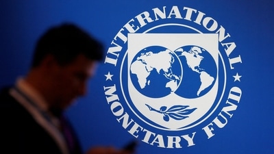 &nbsp;A participant stands near a logo of IMF at the International Monetary Fund - World Bank annual meeting &nbsp;in Nusa Dua, Bali, Indonesia. (Reuters)