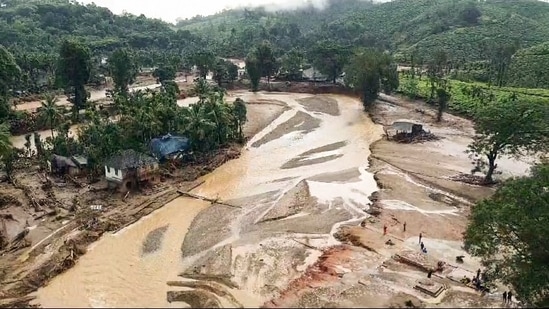 A drone view shows that the entire area in Chooralmala has been inundated. The heavy rainfall has also made Iruvazhinji river swell, flooding all areas on its banks. (ANI Photo)(ANI)