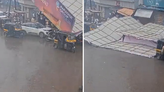 This image shows a huge hoarding on top of a few parked vehicles in Thane, near Mumbai. (X/@ANI)