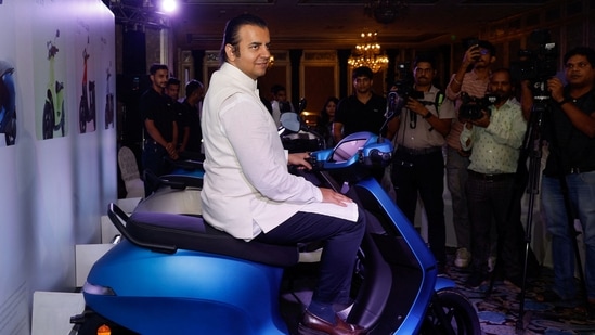 Ola Electric IPO: Bhavish Aggarwal, CEO of Ola Cabs, and founder of Ola Electric, sits on an Ola electric scooter after the press conference ahead of the company's IPO launch in Mumbai.(Reuters)