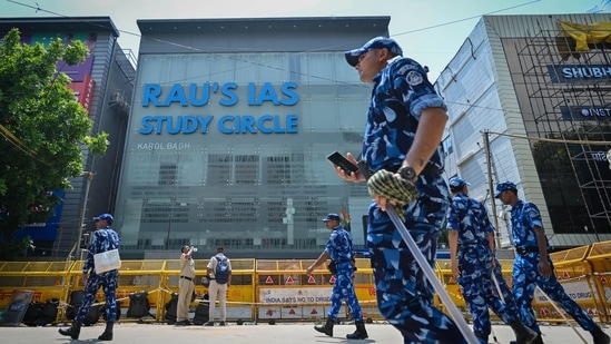  Security officials seen deployed at Rau's IAS Study circle where allegedly 3 UPSC aspirants were drowned to death(Sanchit Khanna/ Hindustan Times)