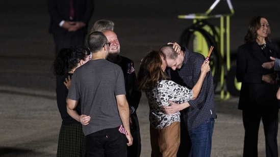 Journalist Evan Gershkovich is kissed on the forehead by his mother, Ella Milman, at Joint Base Andrews, Maryland, US, on Thursday, Aug. 1, 2024. Russia freed Wall Street Journal reporter Evan Gershkovich as well as jailed Kremlin critics in the largest prisoner exchange with the West in decades, in return for a prized assassin sought by President Vladimir Putin. Photographer: Al Drago/Bloomberg(Bloomberg)