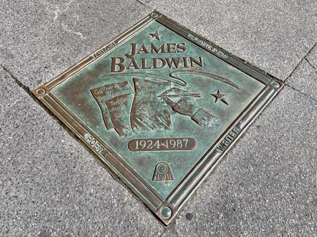 The bronze plaque honouring writer James Baldwin and his famous books on the Harlem Walk of Fame on 135th Street in Harlem, New York. (Here Now/Shutterstock) The bronze plaque honouring writer James Baldwin and his famous books on the Harlem Walk of Fame on 135th Street in Harlem, New York. (Here Now/Shutterstock)