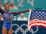 Simone Biles, of the United States, celebrates after winning the gold medal during the women's artistic gymnastics all-around finals in Bercy Arena at the 2024 Summer Olympics, Thursday, Aug. 1, 2024, in Paris, France. Simone Biles, of the United States, celebrates after winning the gold medal during the women's artistic gymnastics all-around finals in Bercy Arena at the 2024 Summer Olympics, Thursday, Aug. 1, 2024, in Paris, France.