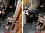 The image shows a man stealing shoes from a rack kept in the corridor of a building in Bengaluru. 