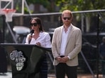 Meghan Markle, left, speaks next to her husband Prince Harry, right, during, the Giant of Africa Foundation at the Dream Big Basketball clinic in Lagos Nigeria, Sunday, May 12, 2024.  (AP Photo/Sunday Alamba)