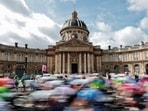 Cyclists in action as they ride past the Institut de France during the race. Tour de Paris: Olympics cycling routes pass iconic landmarks 