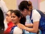 India's Manu Bhaker with her coach during the 25m Pistol Women's final event at the Paris Olympics