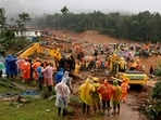 People watch as search operations are carried out after landslides hit Mundakkai village in Wayanad district in Kerala, People watch as search operations are carried out after landslides hit Mundakkai village in Wayanad district in Kerala,