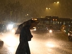 New Delhi, India - July 31, 2024: Commuters stepping out during the evening rain at Mandi House in New Delhi, India, on Wednesday, July 31, 2024. (Photo by Arvind Yadav/ Hindustan Times)(Hindustan Times)