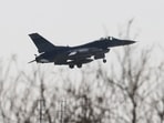 A US Air Force F-16 fighter jet flies. A US Air Force F-16 fighter jet flies.