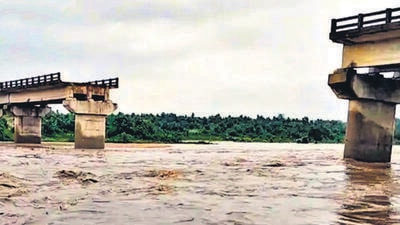 A portion of a bridge collapsed after heavy rains, in Bokaro district of Jharkhand on Saturday. (PTI) A portion of a bridge collapsed after heavy rains, in Bokaro district of Jharkhand on Saturday. (PTI)