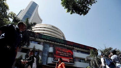 People walk past the Bombay Stock Exchange (BSE) building in Mumbai, India. (Francis Mascarenhas/Reuters)