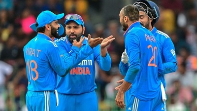 India's Axar Patel (R) celebrates with his captain Rohit Sharma (2L) and teammate Virat Kohli (L) after taking the wicket of Sri Lanka's Janith Liyanage (AFP) India's Axar Patel (R) celebrates with his captain Rohit Sharma (2L) and teammate Virat Kohli (L) after taking the wicket of Sri Lanka's Janith Liyanage (AFP)