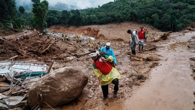 Rescuers make their way to the upper regions as they search through mud and debris for a third day after landslides set off by torrential rains in Wayanad district, Kerala state, India, Thursday, Aug. 1, 2024. (AP) Rescuers make their way to the upper regions as they search through mud and debris for a third day after landslides set off by torrential rains in Wayanad district, Kerala state, India, Thursday, Aug. 1, 2024. (AP)
