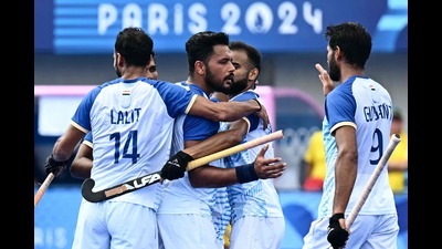 India's defender and skipper Harmanpreet Singh celebrates with teammates after scoring their second goal against Australia at the Paris Olympics. (AFP)