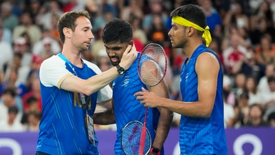 India's Satwiksairaj Rankireddy and Chirag Shetty with coach Mathias Boe after their men's doubles quarterfinal badminton match against Malaysia's Aaron Chia and Soh Wooi Yik (PTI) India's Satwiksairaj Rankireddy and Chirag Shetty with coach Mathias Boe after their men's doubles quarterfinal badminton match against Malaysia's Aaron Chia and Soh Wooi Yik (PTI)