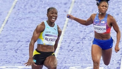 Julien Alfred, of Saint Lucia, crosses the finish line ahead of Melissa Jefferson, of the United States, to win the women's 100 meters final at the 2024 Summer Olympics (AP) Julien Alfred, of Saint Lucia, crosses the finish line ahead of Melissa Jefferson, of the United States, to win the women's 100 meters final at the 2024 Summer Olympics (AP)