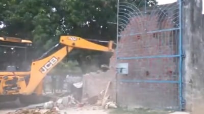 Demolition underway at the bakery of Moid Khan. (ANI)