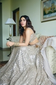 Outfit: Vvani by Vani Vats
Jewellery: The House of MBJ
The actor dazzles in a lehenga Vvani by Vani Vats, an opulent creation that exudes both regal splendour and contemporary allure. This stunning piece, adorned with exquisite hand-cut mirror embroidery, is meticulously crafted over 100 days by a team of over 25 artisans (karigars). The lehenga’s seamless blend of timeless tradition and modern glamour make it the perfect choice for the new-age woman who wishes to celebrate heritage with a contemporary twist. Her look has been rounded off with bangles featuring polki kadas with green enamelling, from The House of MBJ. Outfit: Vvani by Vani Vats
Jewellery: The House of MBJ
The actor dazzles in a lehenga Vvani by Vani Vats, an opulent creation that exudes both regal splendour and contemporary allure. This stunning piece, adorned with exquisite hand-cut mirror embroidery, is meticulously crafted over 100 days by a team of over 25 artisans (karigars). The lehenga’s seamless blend of timeless tradition and modern glamour make it the perfect choice for the new-age woman who wishes to celebrate heritage with a contemporary twist. Her look has been rounded off with bangles featuring polki kadas with green enamelling, from The House of MBJ.