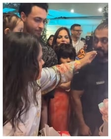 Salman eats a piece of cake offered by Arpita. Salman eats a piece of cake offered by Arpita.