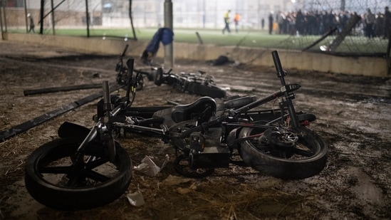 Scattered burned-out bicycles, scooters and electric bikes with melted batteries were found near the area of impact of rockets launched allegedly by Hezbollah on July 27. (AP Photo/Leo Correa)