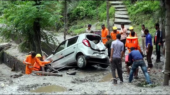 NDRF team trying to retrieve car following a cloudburst in Rampur area of Shimla district.(PTI)