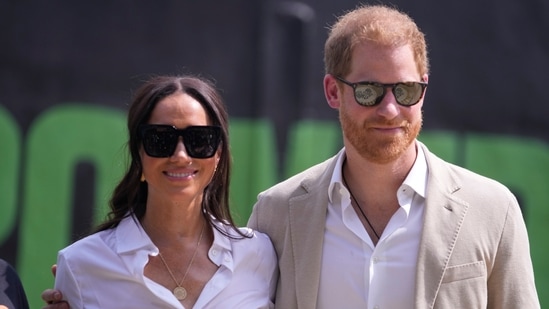 Prince Harry, right, and Meghan, left, attend the Giant of Africa Foundation at the Dream Big Basketball clinic in Lagos Nigeria, Sunday, May 12, 2024. Prince Harry and his wife Meghan are in Nigeria to champion the Invictus Games, which Prince Harry founded to aid the rehabilitation of wounded and sick servicemembers and veterans.(AP)