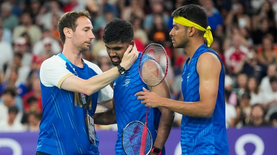 India's Satwiksairaj Rankireddy and Chirag Shetty with coach Mathias Boe after their men's doubles quarterfinal badminton match against Malaysia's Aaron Chia and Soh Wooi Yik(PTI)