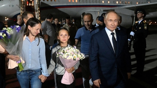 Russian President Vladimir Putin welcomes Russian nationals, including Artyom Dultsev, Anna Dultseva and their children, following a prisoner exchange between Russia with Western countries, during a ceremony at Vnukovo International Airport in Moscow, Russia August 1, 2024.(via REUTERS)