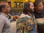 The image shows Anant Ambani’s bodyguard’s reaction to a fan placing his hand around the billionaire heir. The image shows Anant Ambani’s bodyguard’s reaction to a fan placing his hand around the billionaire heir.