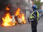 A car burns on Parliament Road during an anti-immigration protest in Middlesbrough, England on August 4, 2024. A car burns on Parliament Road during an anti-immigration protest in Middlesbrough, England on August 4, 2024.
