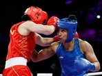 Lovlina Borgohain of India in action against Qian Li of China