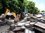 A bulldozer being used to demolish the bakery of Moid Khan who is accused of allegedly raping a 12-year-old girl, in Ayodhya on August 3. A bulldozer being used to demolish the bakery of Moid Khan who is accused of allegedly raping a 12-year-old girl, in Ayodhya on August 3.