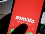 The logo of Indian food delivery company Zomato is seen on its app on a mobile phone displayed in front of its company website in this illustration picture taken July 14, 2021. (Florence Lo/Reuters)