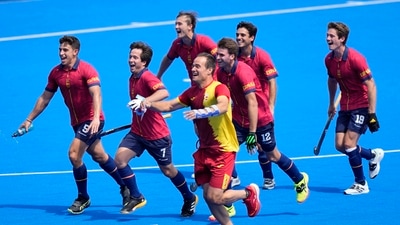 Spanish players celebrate after their win against Belgium in the men's quarterfinal field hockey match at the Yves-du-Manoir Stadium during the 2024 Summer Olympics, Sunday, Aug. 4, 2024, in Colombes, France.AP/PTI(AP08_04_2024_000339A) (AP) Spanish players celebrate after their win against Belgium in the men's quarterfinal field hockey match at the Yves-du-Manoir Stadium during the 2024 Summer Olympics, Sunday, Aug. 4, 2024, in Colombes, France.AP/PTI(AP08_04_2024_000339A) (AP)