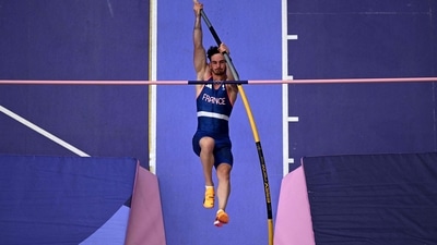 An overview shows France's Anthony Ammirati competing in the men's pole vault qualification of the athletics event at the Paris 2024 Olympic Games at Stade de France in Saint-Denis (AFP)