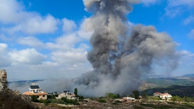 Smoke ascends after an Israeli air raid on the town of Shamaa (Chamaa) in southern Lebanon on August 1, 2024, amid ongoing cross-border clashes between Israeli troops and Hezbollah fighters. (Photo by KAWNAT HAJU / AFP) (AFP) Smoke ascends after an Israeli air raid on the town of Shamaa (Chamaa) in southern Lebanon on August 1, 2024, amid ongoing cross-border clashes between Israeli troops and Hezbollah fighters. (Photo by KAWNAT HAJU / AFP) (AFP)
