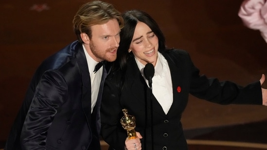 Siblings Billie Eilish and Finneas O'Connell at the Academy Awards ceremony, where they won an Oscar for the song "What Was I Made For?" from Barbie.(AP)