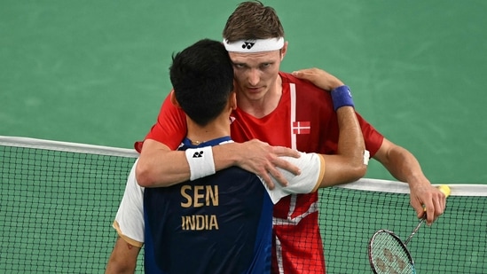 India's Lakshya Sen congratulates Denmark's Viktor Axelsen after their men's singles badminton semi-final match during the Paris 2024 Olympic Games(AFP)