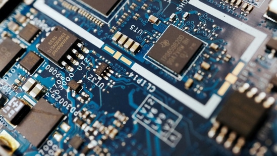 Semiconductor chips are seen on a circuit board of a computer in this illustration picture taken February 25, 2022. (Florence Lo/Reuters)