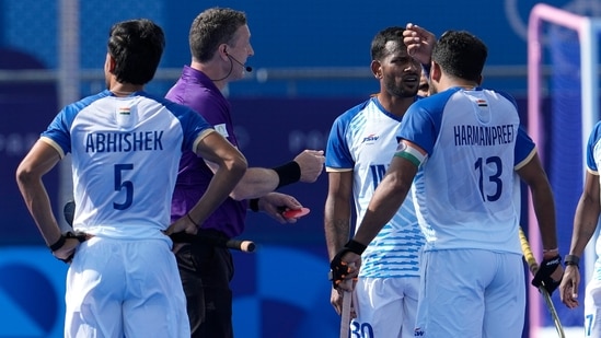 India's Amit Rohidas, second right, reacts after referee showing him red card during the men's quarterfinal field hockey match between Britain and India at the Yves-du-Manoir Stadium during Paris Olympics(AP)