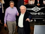 Berkshire Hathaway CEO Warren Buffett (R) talks to Microsoft founder Bill Gates as they play Bridge during the Berkshire Hathaway annual meeting weekend.