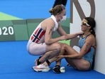 Claire Michel (right) fell ill after competing in the women's triathlon on Wednesday, which included swimming in the Seine River. Claire Michel (right) fell ill after competing in the women's triathlon on Wednesday, which included swimming in the Seine River.