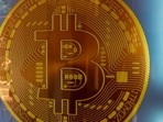 Signage for Bitcoin cryptocurrency is seen. Cryptocurrencies reeled from a bout of risk aversion in global markets and at one point sending Bitcoin down more than 11%. Signage for Bitcoin cryptocurrency is seen. Cryptocurrencies reeled from a bout of risk aversion in global markets and at one point sending Bitcoin down more than 11%.