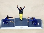 Gold medallist Rebeca Andrade of Brazil celebrates with silver medallist Simone Biles of United States and bronze medallist Jordan Chiles of United States on the podium